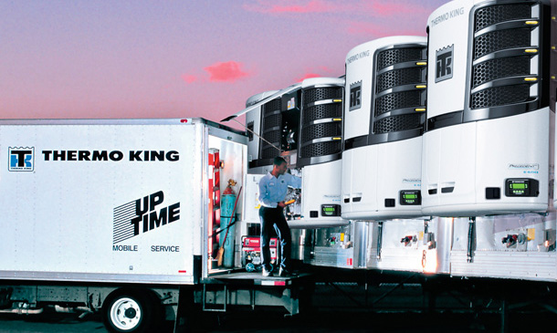 Photo of UpTime mobile service truck near a row of trailers with Precedent units.